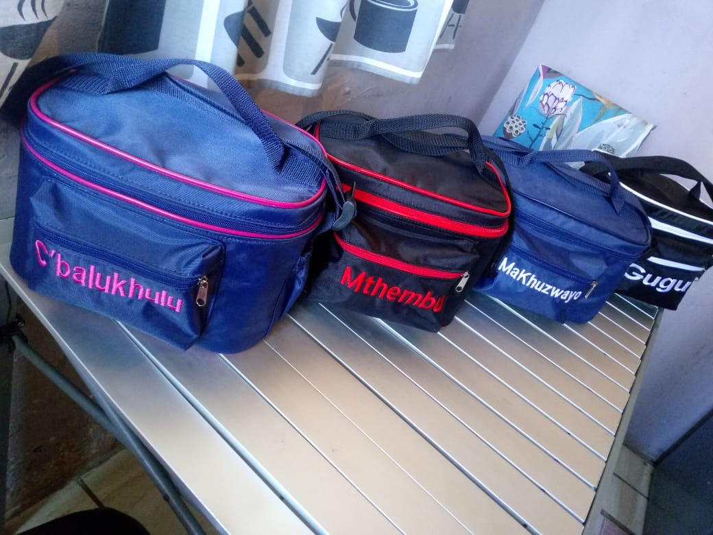 Navy, black and blue cooler bags with names